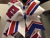 This bow is custom made to your colors and team, name, or mascot.  Measures about 7"x7".  Pictured in white, red, and royal blue.