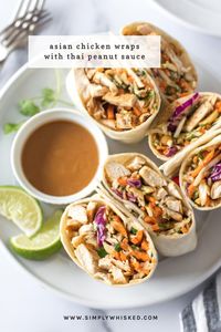 These Asian chicken wraps with peanut sauce are an easy and healthy lunch. Tortillas filled with chicken, crunch coleslaw and peanuts with a spicy, tangy peanut sauce. #chicken #lunch