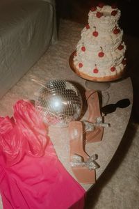 Barbie shooting set up inspiration with vintage cake, sunglasses, disco ball, heels and pink dress 💋