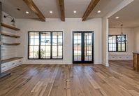 LittleThings.com : Chip and Joanna Gaines Just Built A New Home, And It's Charming As All Heck -- Wooden beams lend to the rustic vibe that resonates throughout the home. Small features, such as energy-efficient lighting, bring modernity to the space.