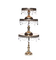 Our Signature design now available in SHINY METALLIC! Chandelier Round Metal Cake Stands  Pedestal base  Set of 3: small, medium & large  Available in Antique Gold, Antique Silver, Shiny Gold, Shiny Rose Gold, Shiny Silver, Pink, White and black  Clear glass chandelier accents  Create elegant cake towers  Small 8”w x 6” h / Medium 10” w x 9” h / Large 12” w x 11” h