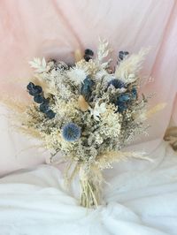 ✿This pampas bouquet features bleached white strawflowers and leaves, dusty blue thistles and preserved eucalyptus including field flowers such as larkspur, bunny tail and preserved Italian ruscus leaves. She will look beautiful on your wedding day, for your events and even for your decorations. Sample bouquet measures 10 inches across, 15 inches tall. Please kindly note each floral piece handcrafted with the same components however each of them arranged slightly different, we believe this is be