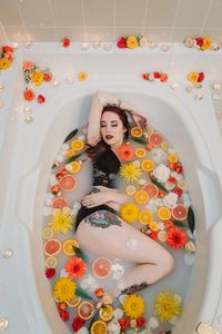 Fine Art Boudoir + Milk Bath Photography by Kirstie Dunston / Kitty Noir Boudoir, Central Kentucky | Tattooed Model | Citrus Flower Bath | Black Lace