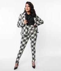 Did someone say Beetlejuice? In collaboration with Beetlejuice, this 1960s inspired pair of cigarette pants is crafted in a black, white, and green plaid. This fun separate is outfitted with a side zipper and hook for ease. Complete with an adorable Beetlejuice embroidery.