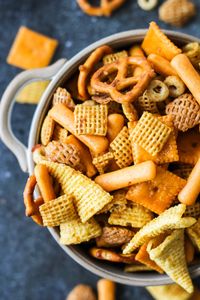 This Easy Nuts and Bolts is a delicious salty and garlicky mixture of cereal, pretzels, nuts and chips!  Makes a big batch.