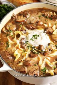 Homemade beef stroganoff soup is an easy comforting food! This recipe is made with steak cubes, mushrooms, egg noodles and a creamy beef broth enhanced with red wine and sour cream.  #spendwithpennies #beefstroganoffsoup #souprecipe #beeffstroganoff #beefrecipe #comfortfood #soup