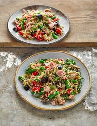 Turn storecupboard staples into this vibrant, nutritious orzo pasta salad with roasted red peppers and black olives