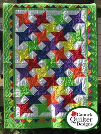 This is a downloadable pattern: When purchased, you will receive an email with a link to your pattern file.This product is not available as a print version at this time. Just two simple blocks nestle together to create a sparkling star quilt pattern. The prairie points overlaid in the border add a fun dimensional element and a little extra twinkle. They're really very easy to make! Bright colors like those used in the cover quilt make this a sure winner with kids of all ages, but this quilt pattern grows up well with other fabric choices too. Choose your palette and let it sparkle! Finished Size: 42 1/2" x 58 1/2" Skill Level: Advanced Beginner Designed by: CQD - Canuck Quilter Designs - Joanne Kerton.