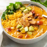 This Creamy Chicken Tortilla Soup recipe is easy to make on the stove top or the Crock Pot. Make it with fresh, leftover, or rotisserie chicken. Cheddar and Cream Cheese add a hint of creamy indulgence!