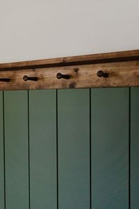 DIY Shiplap and Peg Rail Wall. The perfect "vintage green" feature wall for my son's playroom / future bedroom. #shiplap #featurewall #pegrailshelf #vintage #playroom #bedroom #diy