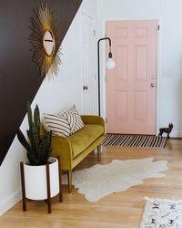 Apartment Therapy on Instagram: “We love how @britdotdesign DIY color blocked her walls and added double sided shelving to create an entry where there wasn't one before.…”