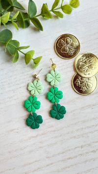 Add a touch of luck and charm to your look with these stacked shamrock dangle earrings. These earrings are perfect for adding a touch of Celtic charm to any outfit, whether you're celebrating St. Patrick's Day or simply seeking a bit of luck in your day-to-day life. Made from high-quality polymer clay, these earrings are lightweight and comfortable to wear throughout the day. Each earring is handmade lead and cadmium free 18K gold plated brass posts. Wandering Calico Clay earrings are styled and