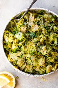 Crisp-tender Lemon Brussel Sprouts are light and bright, made with shaved brussels sprouts, a little chicken broth, lemon juice, and zest. #brussels #sidedish #vegetarian #whole30 #vegan #dairyfree #glutenfree #fatfree #sidedish #weightwatchers