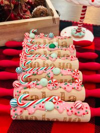 A perfect addition to your Christmas decor or tiered tray! A hand painted mini rolling pin with fake frosting and toppings!  Not for consumption. For decoration only.