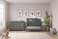 The Denman Collection combines a craftsman aesthetic and pine wood construction with contemporary 90-degree details for a relaxed, modern look. The 4-in-1 Convertible Crib combines an understated paneled headboard and stepped molding with square spindles and slats, while the coordinating dresser, chest, and nightstand feature the same stepped molding details along with rustic metal pulls. Choose from two naturalistic finishes, Crescent Gray and Midnight Gray.