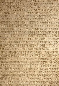 Ancient greek writing on stone photo by andreahast on Envato Elements