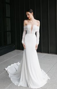 McCartney by Tara LaTour at Sash + Bustle #SashAndBustle #SashAndBustleBride #TaraLaTour #Wedding #WeddingPlanning #WeddingDress #WeddingGown #Bride #BrideToBe #Bridal #WeddingTrends #WeddingInspo #WeddingDressStyle #WeddingDressWithSleeves #ModernWeddingDress #ModernBride #VNeckWeddingDress #VNeckline