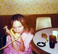 70's mom,the pink robe,the Marlboro lights soft pack, and that brown leather cigarette case. Love it!