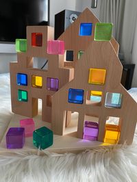 Please note that I am currently in Shanghai due to my work and I pack and ship every single item myself, so this item will ship from Shanghai with tracking number. Wooden Window Houses with our original version lucent acrylic rainbow cubes. Perfect addition for your little builder. Light passes through the cube and reflects that colour. Every set comes with one style of house + 10 pieces of lucent acrylic cubes. Please refer to our other listing for the the upgraded cubes. Please refer below for