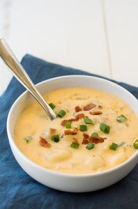 This easy crock pot cheesy potato soup recipe is the perfect family comfort food.