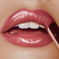 Find CHARLOTTE TILBURY Superstar Lips on Editorialist. Glossy lipstick in dreamy nude pink