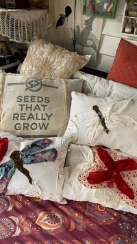  

I re-cycled flour sacks and seed & feed bags, 4 new pillows for the camper couch art space. The others are for the camper bed! There is a bunch behind that are there for the summer porch! Used vintage handkerchiefs to creat the butterfly & dragonfly was fabric sample book from interior design book. 

