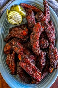 These Cajun ribs feature tender baby back ribs coated in a bold blackened Cajun seasoning, delivering a smoky, spicy kick. Finished with a rich honey butter glaze, they balance the heat with a touch of sweetness for an irresistible flavor.