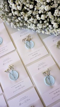 Dried flower and wax seal save the date cards. Includes main A6 invite card and white outer envelopes