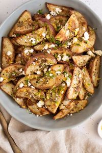 MAKE THESE ROASTED POTATOES WITH FETA AND LEMON! I highly recommend you first roast up a bunch of chicken thighs so you can use the fat (aka schmaltz) that comes off of them to make these – that’s what we did and it makes them mind-blowingly good! I make these roasted potatoes with feta and lemon and GREEK Spice Blend, but you can change it up and try them with almost any other blend you like. They're seriously the best easy side dish for weeknight dinner. Yum. Enjoy!