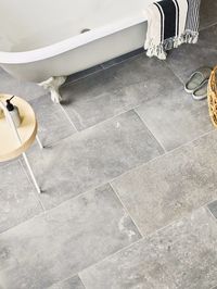 A rectangle in a mid-grey colourway, with a consistent but rustic edge for an authentic feel. The unglazed porcelain makes for a good floor in bathrooms and kitchens, with tile shading varying from one to another increasing the sense of a natural range.