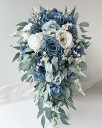 1 x Cascading Bridal Wedding Bouquet  Bouquet is 60 cm long 40 cm across. Finish with white ribbons .