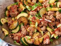 Spicy ground pork and zucchini stir-fry in wok