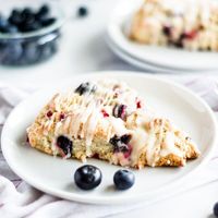 Red, White and Blue Scones just in time to get the ingredients and make them for breakfast tomorrow! ❤️🤍💙The lemon glaze puts these guys over the top. Don’t skip it! Also, I grate the butter on the big holes of the grater and put it on a sheet tray in a single layer before I pop it into the freezer. It’s WAY easier than grating a frozen stick of butter! Try not to overmix the dough once you add in the dry ingredients. Otherwise, you will end up with a dry scone. These have made it on t…