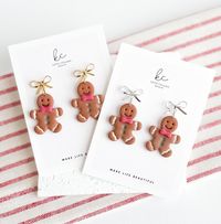 Thank you so much for visiting Katie Collins Design Co. I think you are going to love these cute Gingerbread Man dangle earrings for Christmas! Handmade from polymer clay, these gingerbread man cookie dangles feature a sweet little red bowtie and hand painted green buttons. They swing delicately from either gold or silver bow earring posts made from nickel free brass that are hypoallergenic and perfect for sensitive ears. A wonderful stocking stuffer idea for that special friend this winter, they also make the perfect secret Santa gift this Christmas!  Truly one-of-a-kind, all of my earrings are lovingly handmade by me with extremely lightweight polymer clay and come with nickel free earring posts. I also offer FREE shipping on all orders over $35 as well as include a FREE gift with purcha