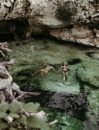 This couple decided to celebrate their elopement in Tulum by spending the evening swimming in their private Cenote.