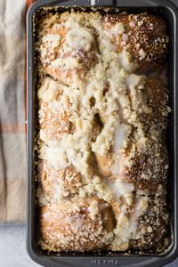 A yummy cinnamon and brown sugar breakfast bread topped with a buttery crumble topping. This bread is perfect toasted and spread with butter or Nutella. #bread #homemadebread #breakfastbread #cinnamonbread