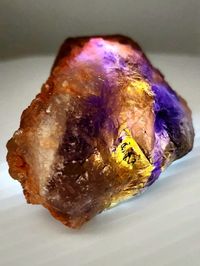 Discover the raw and natural beauty of Ametrine with this authentic rough Ametrine crystal. Sourced directly from nature, this piece showcases the unique combination of amethyst and citrine, creating a striking fusion of violet and golden hues. Unearthed from the depths of the Earth, this rough Ametrine crystal embodies the raw essence of nature. Its untamed form and jagged edges reveal the intricate patterns and color variations that make each piece truly one-of-a-kind. With its mesmerizing blend of purple and yellow tones, Ametrine is believed to possess powerful spiritual and healing properties. It is thought to harmonize the mind, body, and spirit, promoting clarity, balance, and inner strength. Embrace the positive energies that Ametrine is said to bring, and let it inspire your perso