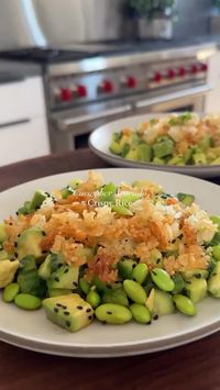 Cucumber Avocado Crispy Rice 🥑🍚 (via: @maxiskitchen)  For the Crispy Rice: ▪️Parchment Paper ▪️3 Tbsp Avocado Oil ▪️2 Cups Cooked Jasmine Rice (it’s important to use jasmine rice not sushi rice) ▪️Kosher Salt  For the Dressing: ▪️2 Tbsp Soy Sauce ▪️1 Tbsp Sesame Oil ▪️3 Tbsp White Vinegar ▪️1/4 tsp Sugar  For the Salad: ▪️3 Medium Persian Cucumbers, diced (~1+1/2 Cups) ▪️1 Medium Avocado, diced ▪️1/3 Cup Shelled Edamame ▪️1/4 tsp Sesame Seeds