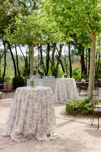 High table during a cocktail hour party with grey toile de jouy napkins and gold lamp #provence #france #wedding #destinationwedding #weddingdestination #weddingdesigner #weddingdecoridea #weddingdeco #lavieestbelle #lavieenrose