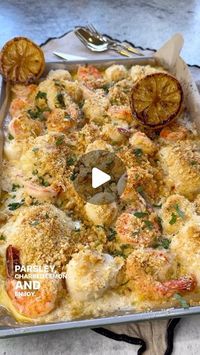 Vesela Asenova| Recipe Creator on Instagram: "Seafood Bake of my Dreams- Cod, Scallops and Shrimp in a creamy, garlicky wine butter sauce with crunchy Parmesan crackers! 
Ingredients: 
1 lbs Cod 
1 lbs Jumbo Shrimp 
1/2 lbs Scallops 
1 stick (1/4 cup) butter, salted 
2 garlic cloves 
1 tsp salt 
1/2 cup white wine 
1/2 cup heavy whipping cream 
The zest of 1/2 lemon 
Black pepper, to taste 
Charred lemon, for serving 
Parsley

Crunchy Cracker Topping: 
4 oz @backtonature round crackers 
2 tbs butter, melted 
1/2 cup Parmigiano Reggiano 

Method: 
1. Preheat oven at 400 F; 
2. Over medium heat melt butter and sauté garlic until fragrant; add wine and cook half way down; season with salt and pepper and lemon zest; turn heat on and add cream; 
3. Pour the sauce over your clean seafood and mak