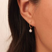 Dainty Pearl Drop Hoop Earrings ◇ Earrings measures approx.:       Hoop - Outer diameter: 10mm / Inner diameter: 8mm      Charm: 6mm (hand forged earrings vary slightly) ◇ These earrings are sold as pair. A D D I T I O N A L ∙ I N F O R M A T I O N * These earrings will arrive in an eco-friendly jewelry paper box, making it a nice gift to give a friend or keep for yourself. They are reusable and recyclable. * Have any questions or need advice on your custom design? Feel free to contact us. We ar