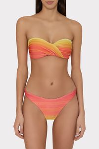 Made from textured ombré swim fabric with lurex detail, the Margot bikini bottom is lined, has a scoop leg and offers medium brief coverage. Wear it with its coordinating Sunset Stripe bikini top and sarong.