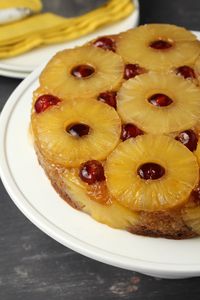 This delicious vegan pineapple upside down cake is moist, rich and topped with pineapple, cherries and caramelized brown sugar. | lovingitvegan.com