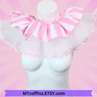 Get ready to clown around in style with this frilly ruffled collar! Whether you're gearing up for a spooky circus, a fun photo shoot, or a wild cosplay adventure, this collar has got you covered. It's fully adjustable buy tying  it with the long ribbons and will fit any neck size. You can leave the bow long and position it to the front back or side.  I can make these in just about any color combo you can think of so if you love the style but not the color, drop me a message and we can work together to make you a custom listing for with your color choices. This is made to order.  It will ship pretty quickly... but not immediately. This listing is only for the neck collar.  All other items are photo props and NOT included.