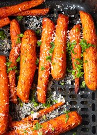 Air Fryer Roasted Carrots made two different ways. Whether you like sweet or savory carrots, this recipe has you covered. Make them in the air fryer in less time than a traditional oven. #airfryervegetables #airfryerrecipes