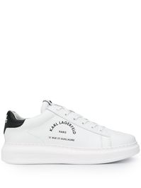 White leather low top lace-up trainers from KARL LAGERFELD featuring logo-embossed tongue, front lace-up fastening, round toe, contrasting heel counter, logo print to the side and chunky rubber sole.