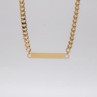 Crafted in 18k gold plated stainless steel, the Javis ID Necklace features a shiny curb...