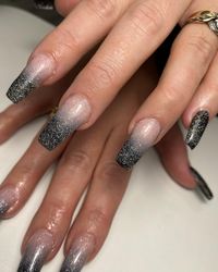 Do you love the look of black ombre nails? Add some glitter nail polish to completely transform them into party ready look! In this article you will find the best nail design ideas for black glitter ombre nails for any nail shape - coffin nails, almond nails or short natural nails. Get inspired!