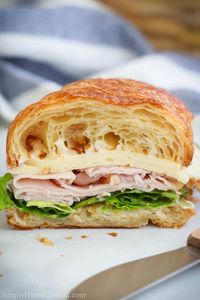 This Turkey Croissant Sandwich is the perfect finger food for tea parties or casual get-togethers. Simple and delicious, everyone loves these sandwiches. #sandwich #turkeysandwich #croissantsandwich #turkeycroissantsandwich