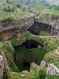 (Baatara gorge waterfall) is a waterfall in the Tannourine, Lebanon near Balaa  The waterfall drops 840 ft into the Balaa Pothole, a cave of Jurassic limestone located on the Lebanon Mountain Trail. The cave is also known as the Cave of the Three Bridges.  During the spring melt 300–330 ft cascade falls behind the three bridges and then down into the 790 ft chasm. 34°10'23.1"N 35°52'13.2"E